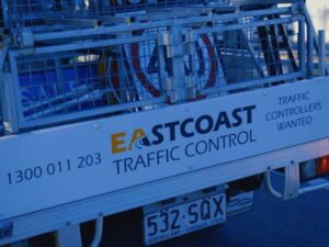 Traffic Management Implementer setting up road signage in Queensland