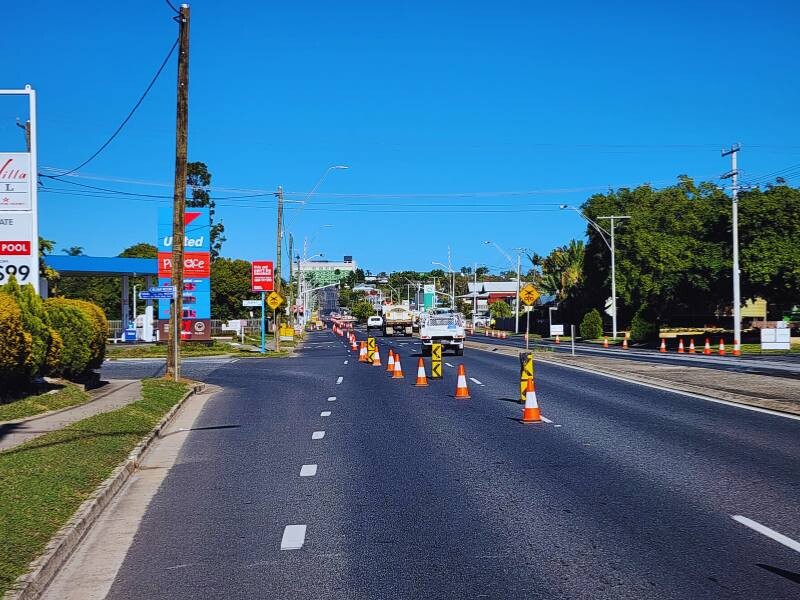 Traffic controllers ensuring safety at a busy construction site.